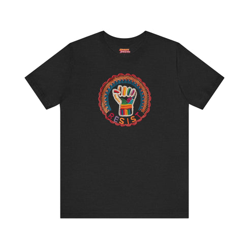 Black short-sleeve t-shirt featuring a bold embroidered design centered on the chest. The design showcases a raised fist wrapped in multicolored thread, symbolizing strength and resistance. Surrounding the fist is a circular embroidered border with intricate, colorful stitching in shades of red, orange, blue, and yellow, creating a striking contrast against the black fabric. Below the fist, the word "RESIST" is embroidered in capital letters using a gradient of warm-toned thread. The t-shirt has a classic c